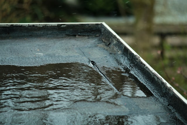 An open lap seam on a torch-applied flat roof